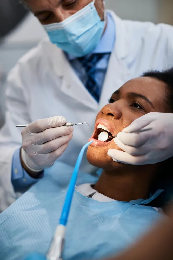 Black Woman Having Her Teeth Checked During Appointment